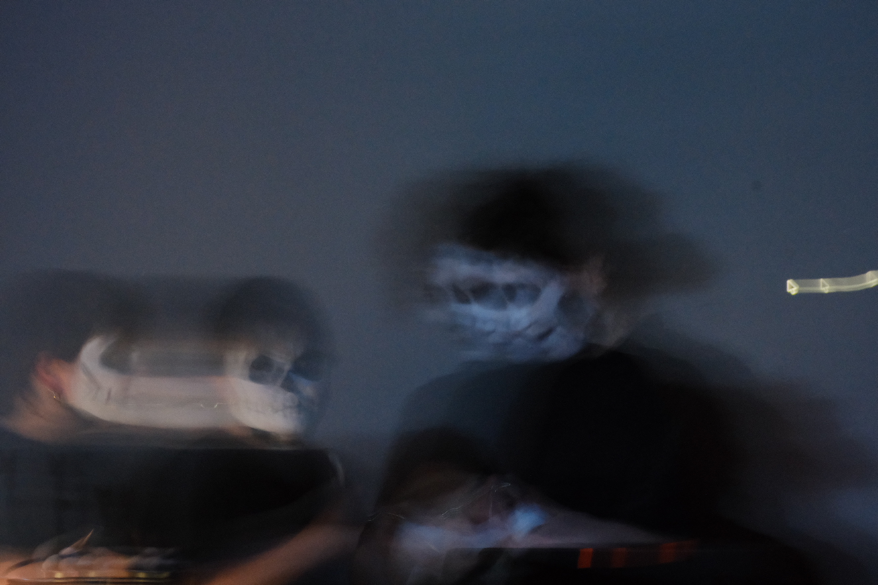 Two performers dressed in black, with skeleton-like face paint. From left to right: Katie Tindle, Irini Kalaitzidi, 2025